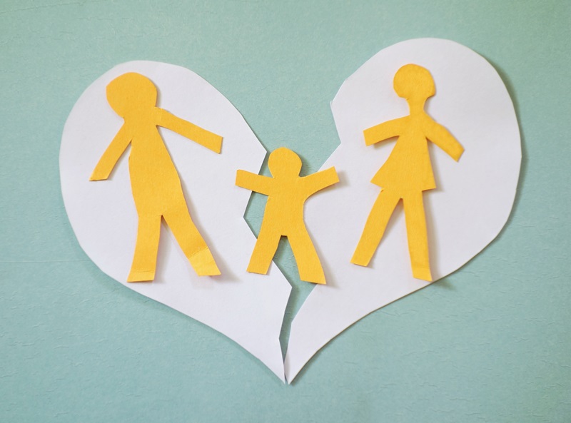 Broken family heart break Paper family couple with child over a broken heart